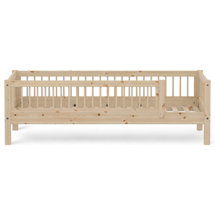 Flexa. CLASSIC bed with backrest, head- and foot board and 3/4 safety rail. Use it for your toddler, who just has grown out of the baby bed. The bed is crafted from solid pinewood.