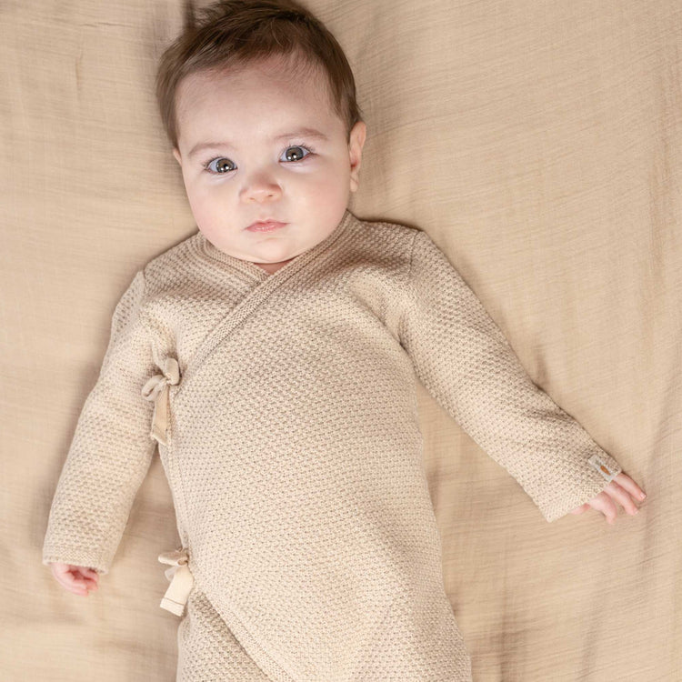 LITTLE DUTCH. Knitted one-piece wrap suit Sand